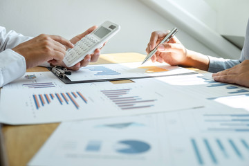 Two business partner team meeting and discussion financial project of investment ideas, presentation and analyzing marketing planning strategy of business making to growth profit and successful