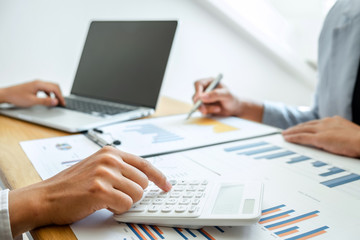 Two business partner team meeting and discussion financial project of investment ideas, presentation and analyzing marketing planning strategy of business making to growth profit and successful