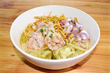 Curry Noodle Soup with Chicken (KhaoSoi Kai), Thai traditional northern style food.