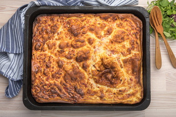 Swedish traditional oven pancake ugnspannkaka with bacon, a kind of batter pudding.