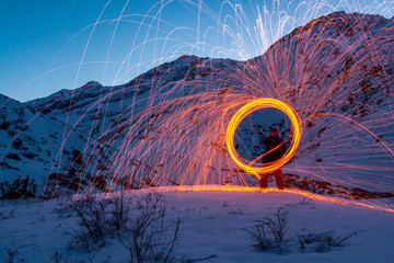 sparkling circle in the mountains above a man