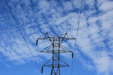 power transmission tower on background of blue sky