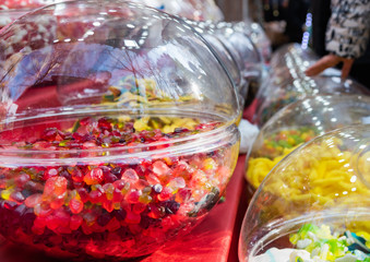 Candies in round boxes.