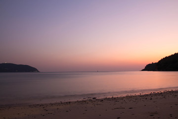 Beautiful light landscape in the evening sky when the sun sets in the sea and mountains.