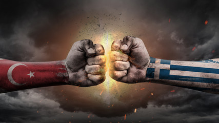 Turkey vs Greece. Fists with flags. Battle of two countries on sky.	 - obrazy, fototapety, plakaty