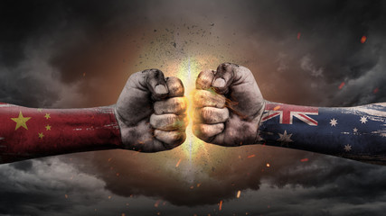 China vs Australia. Fists with flags. Battle of two countries on sky.	