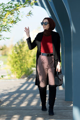 Muslim young woman waving hand to friend