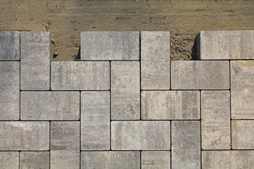 Regular shape blocks, texture, background. Paving slabs of gray blocks of flat shape, close-up....