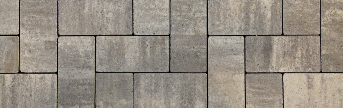 Regular Shape Blocks, Texture, Background. Paving Slabs Of Gray Blocks Of Flat Shape, Close-up. New Pavement In The City Park. Arrangement Of A Park Way