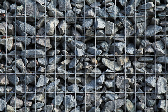 Gabion, texture, background. Gabion net frequent part (design). New technologies in the manufacture of retaining walls and fences. Landscaping. Fencing decorative elements