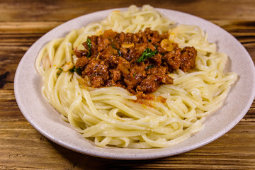 Pasta with bolognese sauce in a ceramic plate