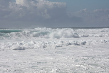 Foam of the sea. storm. white waves and blue background