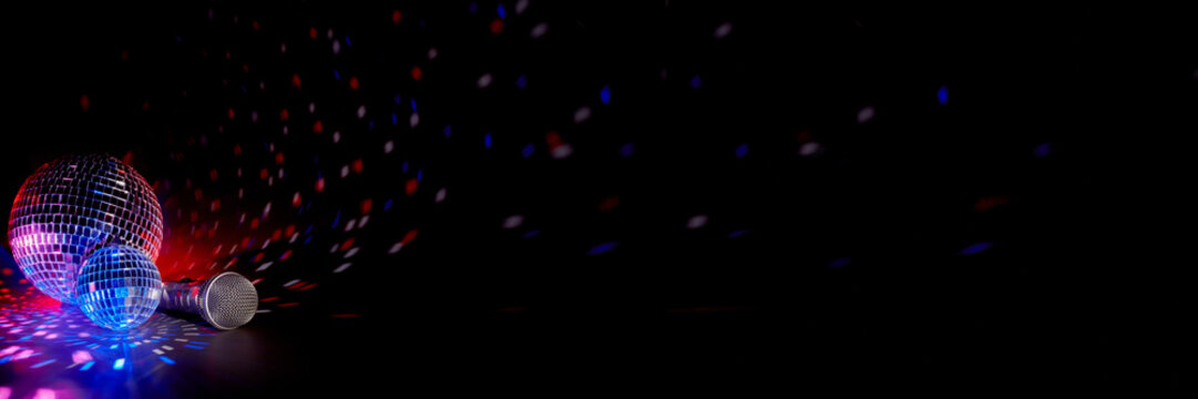 Microphone and  glittering mirror disco balls. Karaoke club. For advertising or web design. Entertainment or music show extra wide panorama banner background
