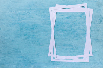 White paper frame design on blank blue texture background