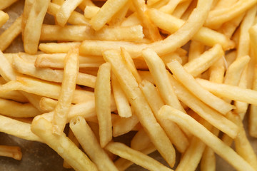 Tasty french fries texture close up, top view