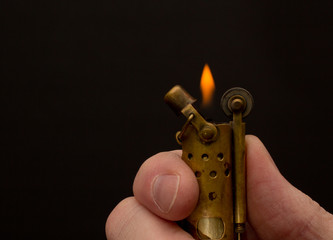 Vintage lighter detail on black with copy space