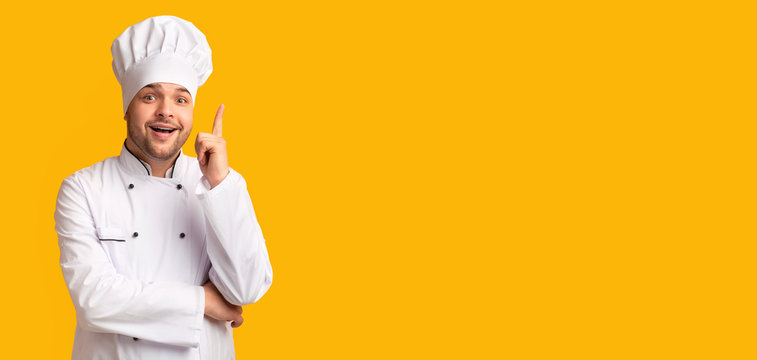 Excited Chef Man Pointing Finger Up Over Yellow Background, Panorama