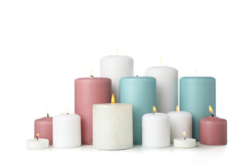 Group of different candles isolated on white background