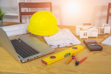 Construction Engineer working tools with laptop computer
