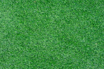Texture of fake green grass for background or backdrop.