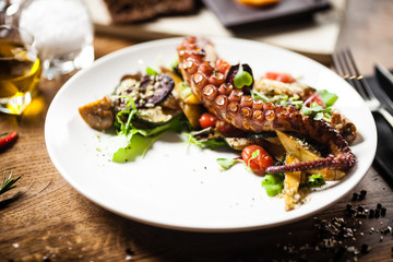 Octopus salad served on a plate in restaurant