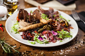 Meat platter for two served on a plate in restaurant