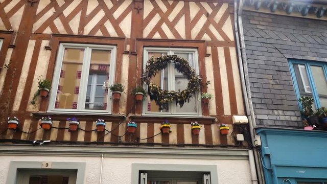HONFLEUR, FRANCE - APRIL 08, 2018: view of empty beautiful street with old traditional houses at the center of Honfleur, Normandy, France