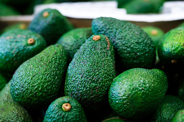 Fresh green hass avocado in fruit market