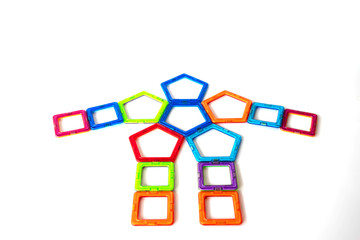 Magnetic toys on white background.	