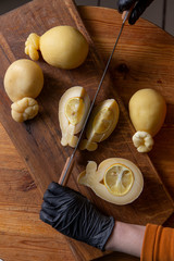 Sliced head of Italian hard cheese Scamorza or Caciocavallo with lime. caciocavallo - Italian cheese made from cow's or sheep's milk, closeup.