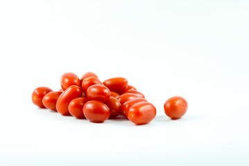 Red grape tomatoes isolated on a white background.