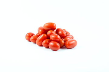 Red grape tomatoes isolated on a white background.