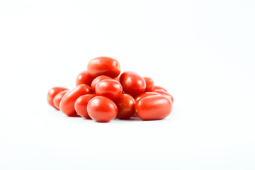 Red grape tomatoes isolated on a white background.