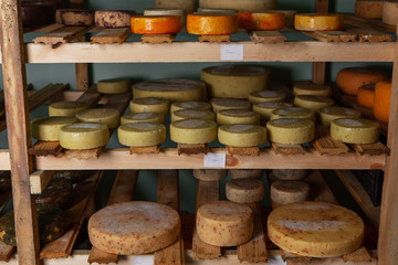 Cow milk cheese, stored in a wooden shelves and left to mature