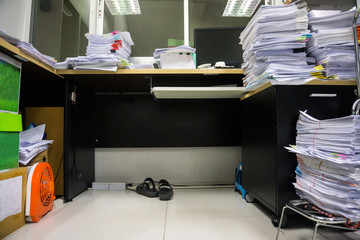 Busy, messy and cluttered workplace, full of documents