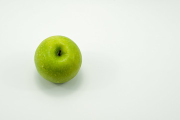 Fresh green apples on a white background isolated.