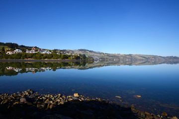 Beautiful reflection and lake under the daylight in Tekapo Lake in South Island New Zealand.