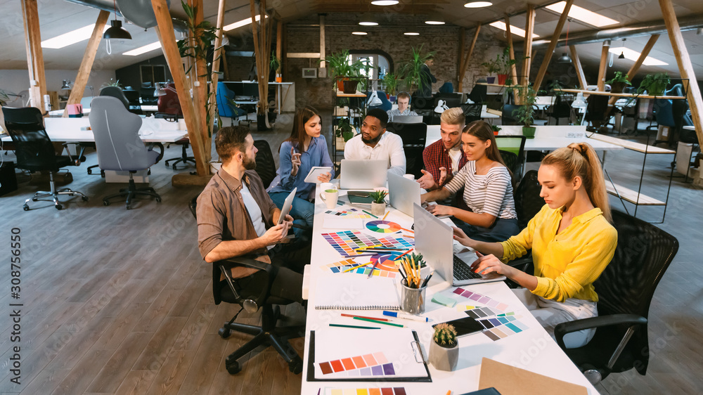 Poster coworking process. designers working with project in office