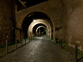 Fototapeta na wymiar Caelian hill rampant arches at night in Rome