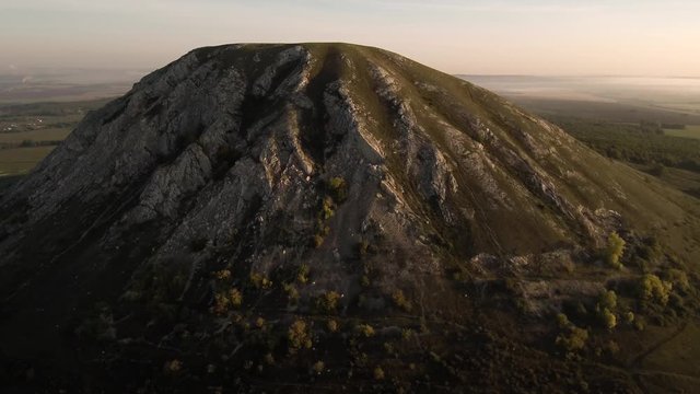 The remain of the reef of the ancient sea, composed of limestone - shikhan Toratau. Aerial view.