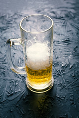 Pub concept. Half a glass of beer. Close-up, copy space