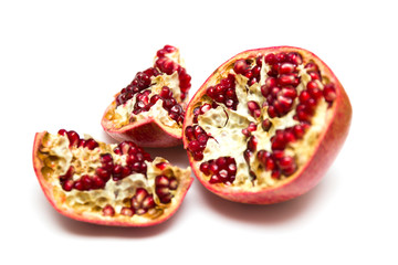 Sliced pommegranate on the white background