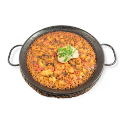 Paella young gentleman style rice with sliced squid and mussels from which the shell has been removed.