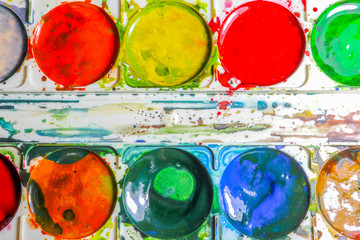 watercolor paints in a box as a background macro