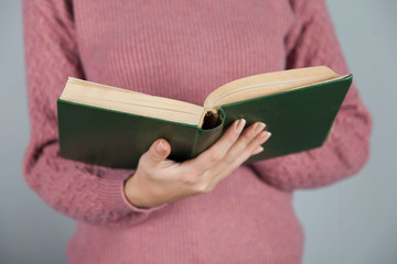 woman hand holding book