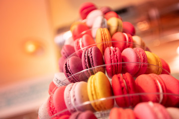 Colored red macaroon France pastry desserts on store counter