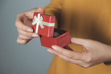 woman hand holding box with ring