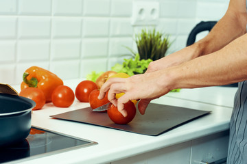 woman cutting vegetables in the kitchen