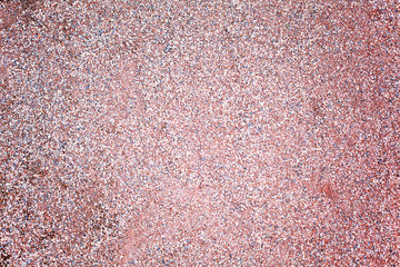 Brown texture of wet red granite Gravel. Sand and stones in water on the floor background.