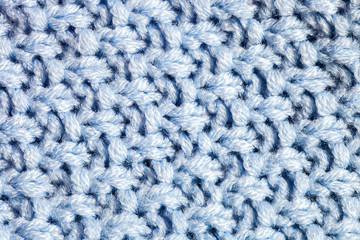 Texture blue acrylic knitted sweater. Rice stitch knitting pattern close up